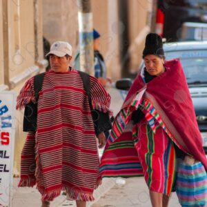 Woman and men wearing traditional Tarabuco attire