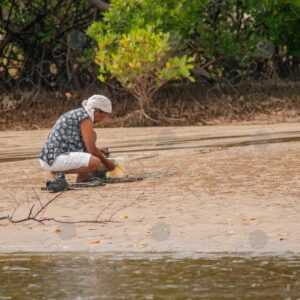 Woman working with river cages