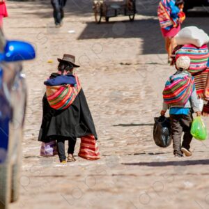 Young child, carrying bags