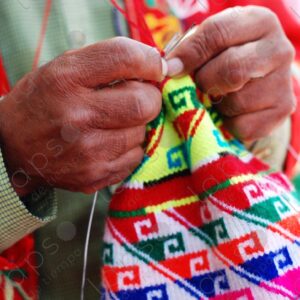 Detail hands man weaving colorful traditional hat 1