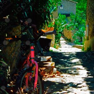 Pink bicycle on a stone path