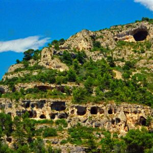 Prehistoric cave dwellings clinging to mountain cliffs, Vaucluse, Luberon, Provence 1