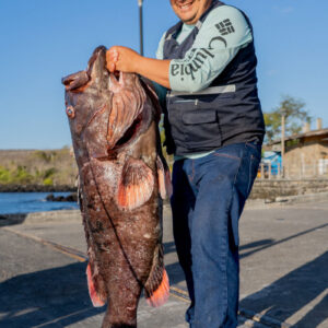 man poses with fish 5