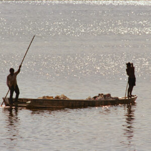 sunset young people standing in a canoe 2